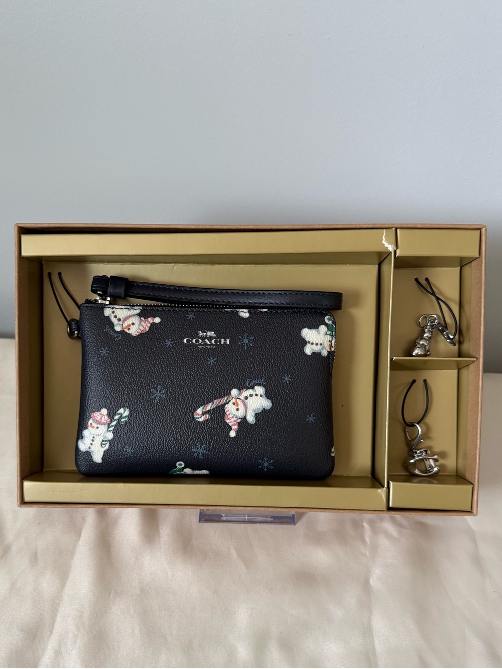 Coach Snowman Print Corner Zip Wristlet With Charms